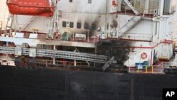 FILE - This photo shows the U.S.-owned Genco Picardy that was attacked Jan. 17, 2024, with a drone launched by Houthis in the Gulf of Aden. The International Rescue Committee is now diverting aid shipments away from the Red Sea. (Indian navy via AP)