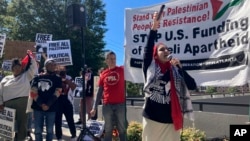 Pro-Palestinian demonstrators chant slogans outside the Israeli consulate in Atlanta on Oct. 8, 2023.