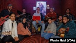 The duo of Irfan and Bilal provide training to dozens of youth inside their studio using modern musical instruments.