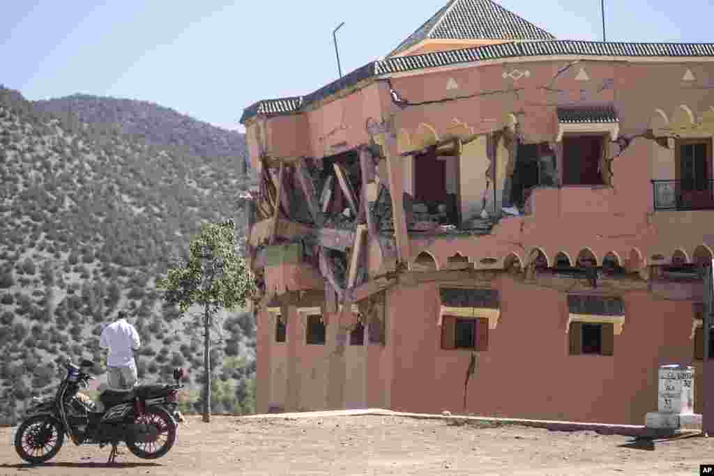 A man stands next to a damaged hotel after the earthquake in Moulay Brahim village, near the epicenter of the earthquake, outside Marrakech, Morocco, Sept. 9, 2023.