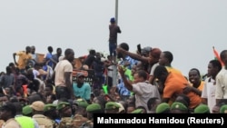 Thousands of Nigerians gather in front of the French army headquarters in support of the putschist soldiers and to demand the French army to leave in Niamey, Niger, Sept. 2, 2023. (Mahamadou Hamidou/Reuters)