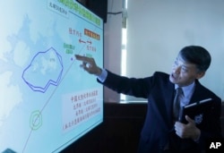Coastal Control Division Chief Liao Yun-Hung talks about a fishing boat intercepted by Chinese vessels Tuesday night, during a news conference in Taipei, Taiwan, July 3, 2024.