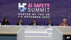 FILE - Britain's Prime Minister Rishi Sunak, center, speaks during a plenary session at the AI Safety Summit at Bletchley Park in Milton Keynes, England, Nov. 2, 2023. 