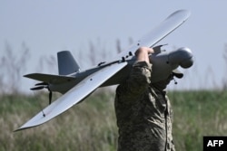 A Ukrainian serviceman prepares to fly a Leleka reconnaissance drone near Chasiv Yar, Donetsk region, April 27, 2024.