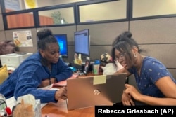 Success Coach Latasha Wiley, left, helps first-year student Amare Porter, right, with her class schedule at Chattahoochee Valley Community College's advising center on Feb. 23, 2023, in Phenix City, Ala. (Rebecca Griesbach/Press-Register via AP)