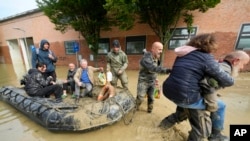 People are rescued in Faenza, Italy, May 18, 2023. 