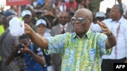 Albert Ondo Ossa, the leader of Gabon's main opposition coalition Alternance 2023, dances during a campaign meeting in Libreville on Aug. 20, 2023.