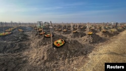 FILE - Graves of Russian Wagner mercenary group fighters are seen in a cemetery near the village of Bakinskaya in Russia's Krasnodar region, Jan. 22, 2023.