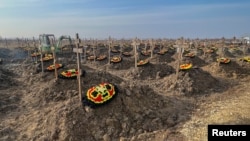 ফাইল ছবি - রাশিয়ার ক্রাসনোদার অঞ্চলের বাকিনস্কায়া গ্রামের কাছে একটি কবরস্থানে রাশিয়ান ভাগনার ভাড়াটে গোষ্ঠীর যোদ্ধাদের কবর দেখা যাচ্ছে । ( ২২ জানুয়ারি, ২০২৩) 