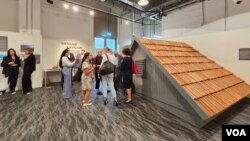 "The Roof," an installation in the Ukraine pavilion at the COP28 climate summit in Dubai, UAE, commemorates the homes lost to flooding in the Kherson region caused by the Kakhovka Hydroelectric Power Plant explosion, Dec. 5, 2023. (Bilal Hussain/VOA)