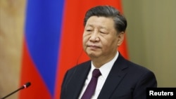 Chinese President Xi Jinping attends a meeting with Russian Prime Minister Mikhail Mishustin in Moscow, March 21, 2023.