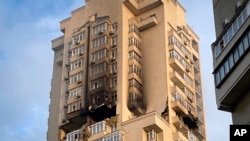 A multi-story apartment building is seen damaged following a Russian attack in Kyiv, Ukraine, June 24, 2023.