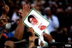 Scene from a demonstration by the supporters of the opposition BNP in Dhaka on Nov. 30, 2021. 'Free my mother, without attaching any condition,' says the poster. (Babul Talukdar/VOA) 