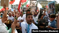 People protest in Trafalgar Square in London on the first anniversary of the death of Mahsa Amini, a 22-year-old Kurdish woman arrested by the morality police in 2022 for allegedly flouting mandatory dress codes, in London, Britain, Sept. 16, 2023. 