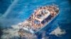 FILE - This undated handout image provided by Greece's coast guard on Wednesday, June 14, 2023, shows scores of people on a battered fishing boat, the Adriana, that later capsized and sank off southern Greece.