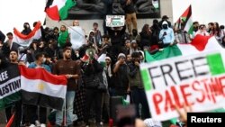 Demonstrators protest in solidarity with Palestinians in Gaza, amid the ongoing conflict between Israel and the Palestinian Islamist group Hamas, in London, Oct. 21, 2023.