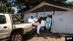 FILE - Workers load the body of a man from a makeshift morgue into a vehicle at a in Lilongwe, Malawi, Feb. 21, 2023. Cases of suicide in the country have more than doubled in the past five years, police records show.