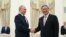 Russian President Vladimir Putin, left, and Chinese Premier Li Qiang shake hands during their meeting at the Kremlin in Moscow, Russi, Aug. 21, 2024. 
