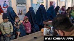 Afghan women and children refugees deported from Pakistan wait in a nutrition ward at the United Nations High Commissioner for Refugees camp on the outskirts of Kabul, Afghanistan, Jan. 9, 2024.