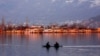 Kashmiri boatmen row their shikara (wooden boats) alongside the famous houseboats in the state’s most popular tourist spot: Dal Lake, Srinagar. (Muzamil Mattoo/VOA)
