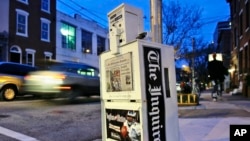 FILE - A Philadelphia Inquirer newspaper vending machine stands in Philadelphia on Nov. 30, 2006. The Inquirer experienced the most significant disruption to its operations in 27 years due to what the newspaper calls a cyberattack on May 14, 2023. 