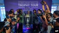 Photographers take pictures during a trophy tour of the upcoming ICC Men's Cricket World Cup at the Rajiv Gandhi International Cricket Stadium in Hyderabad, India, Sept. 21, 2023. 