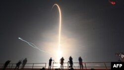 This timed exposure shows the trail as the SpaceX Falcon 9 rocket with the company's Crew Dragon spacecraft lifts off from pad 39A for the Crew-6 mission at NASA's Kennedy Space Center in Cape Canaveral, Florida, early March 2, 2023.