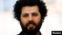 FILE - Iranian film director Saeed Roustayi poses at the 75th Cannes Film Festival in Cannes, France, on May 26, 2022. Iran imposed a six-month suspended prison sentence on Roustayi and his producer for showing their movie, "Leila's Brother," at the festival.
