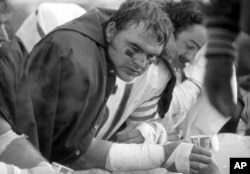 FILE - Chicago Bears linebacker Dick Butkus catches his breath as his team's offense worked against the Green Bay Packers during an NFL football game in Green Bay, Wis., Nov. 15, 1970. Butkus, a fearsome middle linebacker, died Oct. 5, 2023, at age 80.