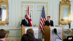 British Foreign Secretary James Cleverly, left, holds a joint news conference with U.S. Secretary of State Antony Blinken in London, June 20, 2023.