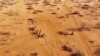 FILE - People arrive at a displacement camp on the outskirts of Dollow, Somalia, Sept. 21, 2022 amid a drought. 