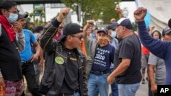 Protesters demanding the resignation of Attorney General Consuelo Porras block the Inter-American Highway in San Lucas Sacatepéquez, Guatemala, FOct. 13, 2023. 