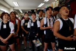 Tokyo Rikchsaw pullers attend a morning meeting at the office in the Asakusa district, Tokyo, June 18, 2023.
