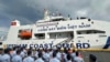 Philippine Coast Guard personnel wave Vietnamese and Filipino flags to welcome the Vietnam Coast Guard ship CSB 8002 in Manila, Philippines, Aug. 5, 2024.