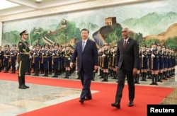 FILE PHOTO: Chinese President Xi Jinping and Maldivian President Mohamed Muizzu attend a welcome ceremony at the Great Hall of the People in Beijing, Jan. 10, 2024. (cnsphoto via Reuters)