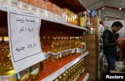 Oil bottles are displayed at a market selling food at discounted prices, after a devaluation of the Egyptian pound led to a sharp increase in prices, in Giza, Jan. 28, 2023.