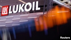 FILE - A Lukoil sign is seen in Abu Dhabi, United Arab Emirates, Oct. 2, 2023.