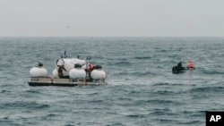 In this image released by Action Aviation, the submersible Titan is prepared for a dive into a remote area of the Atlantic Ocean on an expedition to the Titanic on June 18, 2023.