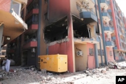 Residential buildings damaged in fighting are seen in Khartoum, Sudan, April 20, 2023.