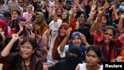 FILE - Students and job seekers shouts slogans as they protest, calling for a ban on quotas for government jobs, at Shahbagh Square in Dhaka, Bangladesh, July 3, 2024.