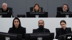 FILE - Presiding judge Mappie Veldt-Foglia, top center, prepares to read the verdict in the case of Salih Mustafa, a former Kosovo rebel, at the Kosovo Specialist Chambers court in The Hague, Netherlands, Dec. 16, 2022.