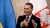 FILE - Polish Foreign Minister Radoslaw Sikorski speaks to reporters during his visit in Kyiv, Dec. 22, 2023.