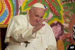 FILE - Pope Francis delivers his blessing at the Vatican, May 25, 2023.