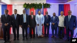 Haiti's transitional council members pose for a group photo after a ceremony to name its president and a prime minister, in Port-au-Prince, Haiti, April 30, 2024.