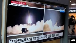 FILE - A TV screen shows images of a North Korean missile launch during a news program at the Seoul Railway Station, in Seoul, South Korea, Aug. 31, 2023.