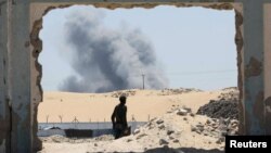 Smoke rises following Israeli strikes, in Khan Younis in the southern Gaza Strip, Aug. 8, 2024. 