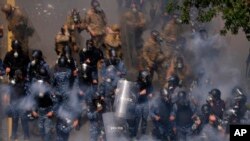 Lebanese security fire tear gas against retired members of the Lebanese security and other protesters in Beirut, Lebanon, March 22, 2023.