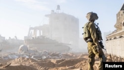 FILE - An Israeli soldier is seen during a mission in the Gaza Strip amid the ongoing conflict between Israel and the Palestinian Islamist group Hamas, in this handout photo released Dec. 30, 2023. (Israel Defense Forces/Handout via Reuters)