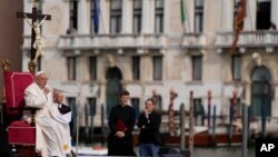 Pope Francis delivers his message as he meets with young people in front of the Church of the Salute in Venice, April 28, 2024. 