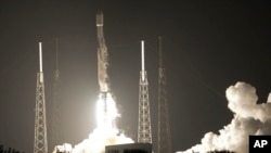 FILE - A SpaceX Falcon 9 rocket, with a payload including two lunar rovers from Japan and the United Arab Emirates, lifts off from Launch Complex 40 at the Cape Canaveral Space Force Station in Cape Canaveral, Fla., on Dec. 11, 2022.